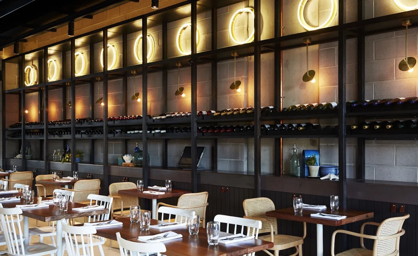 Beccafico — illuminated ring-light feature wall